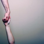 a hand reaching down to rescue someone in need.